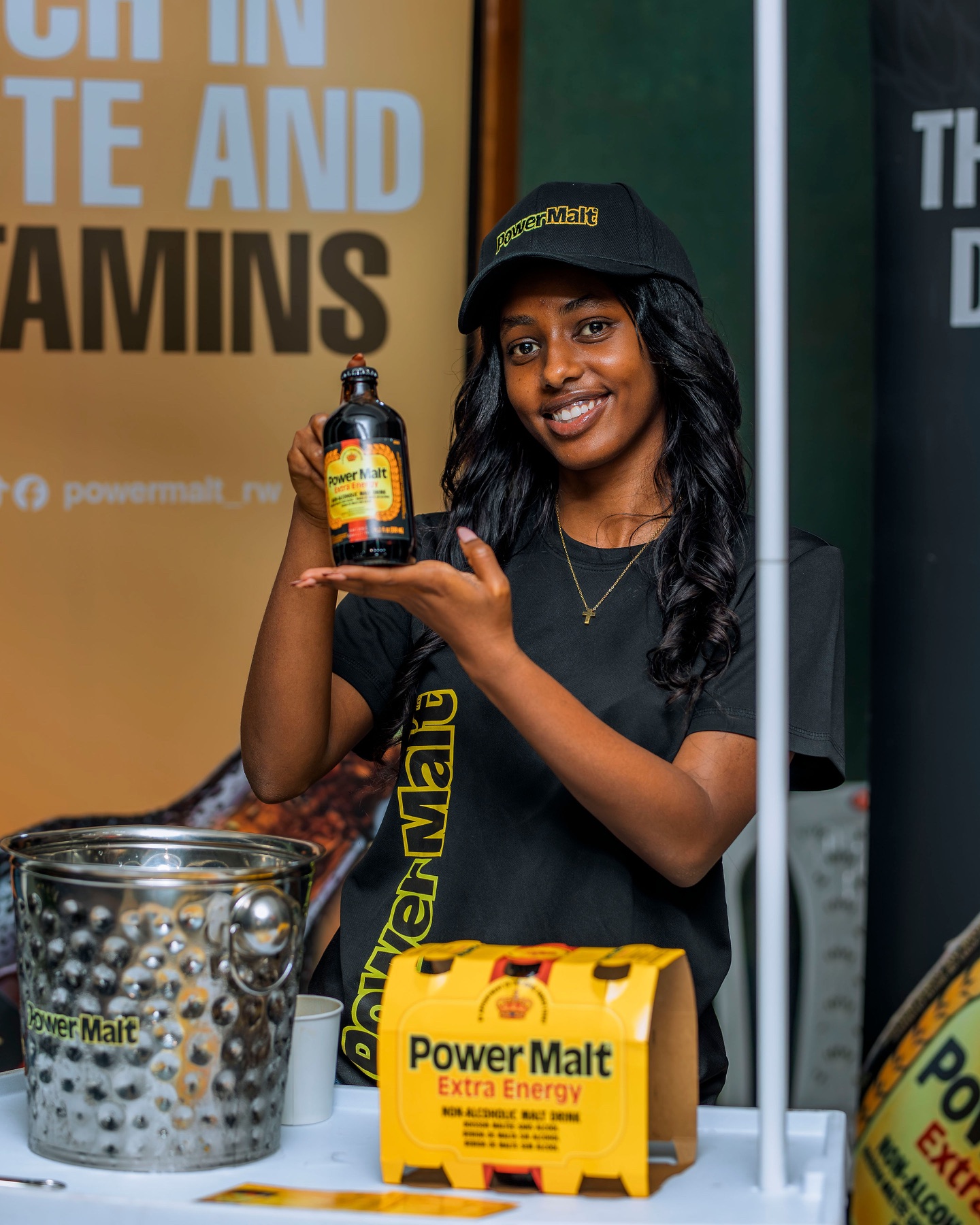 Power Malt ambassador holding a bottle
