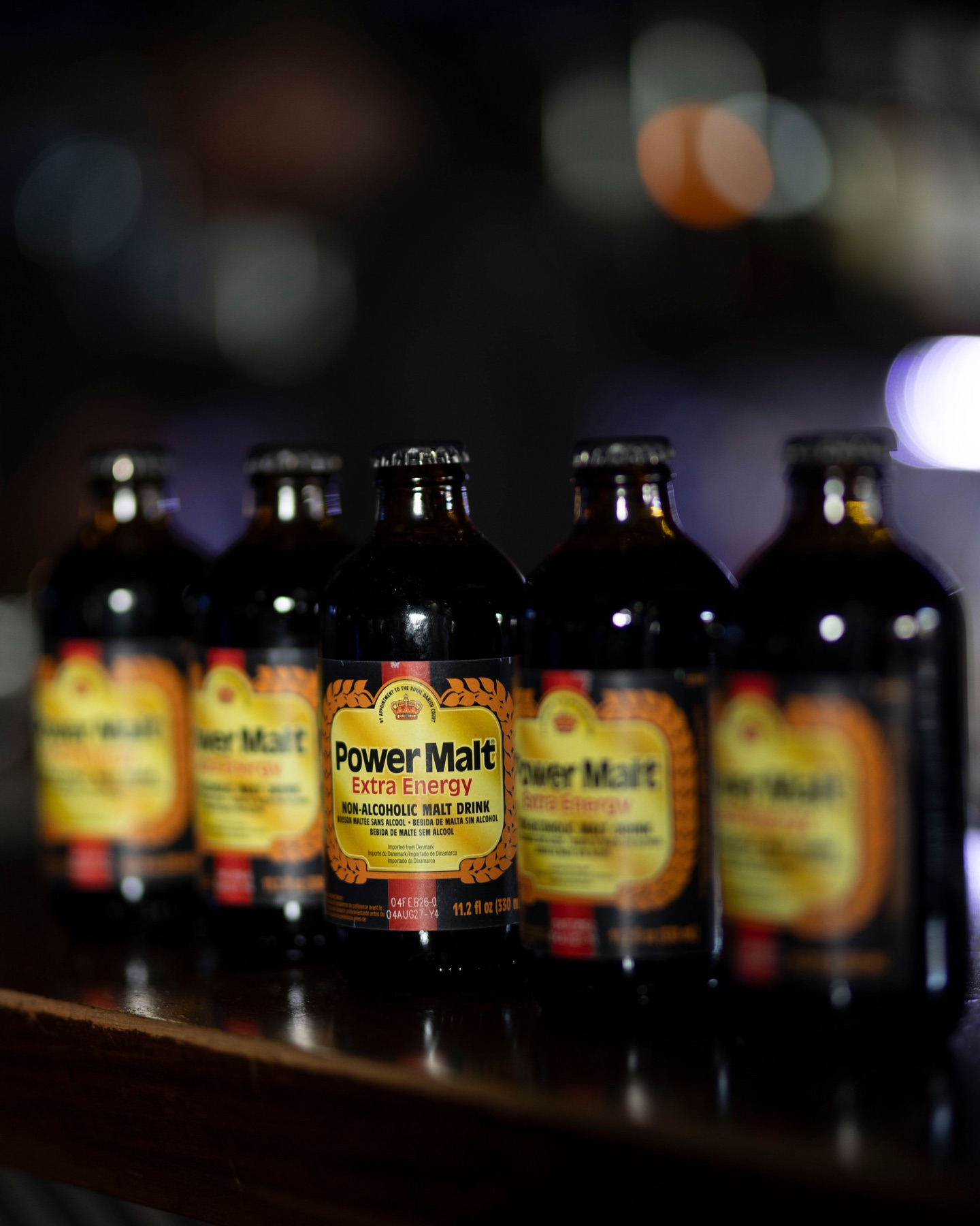 Power Malt bottles in a premium display line