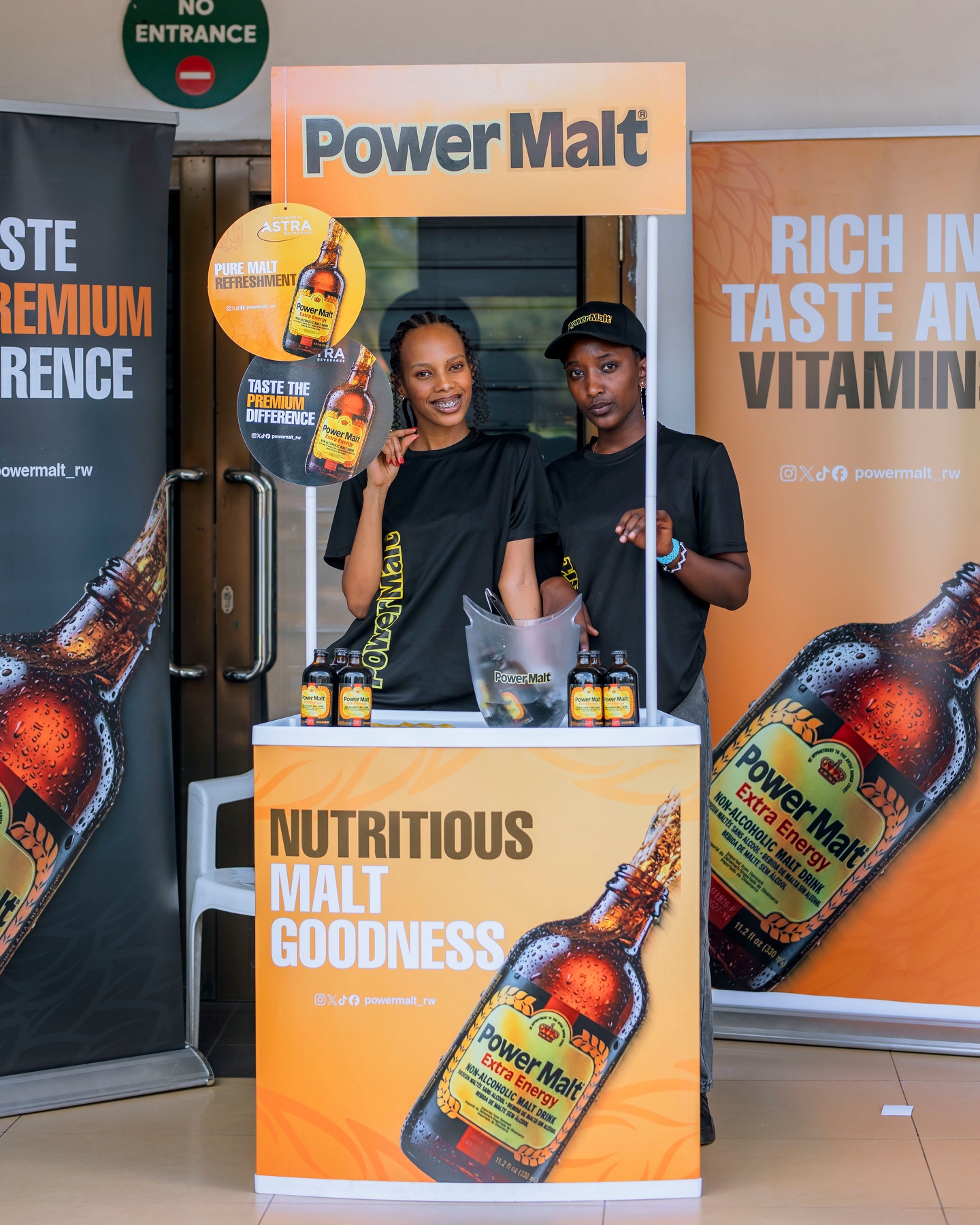 Power Malt ambassadors behind a branded stand