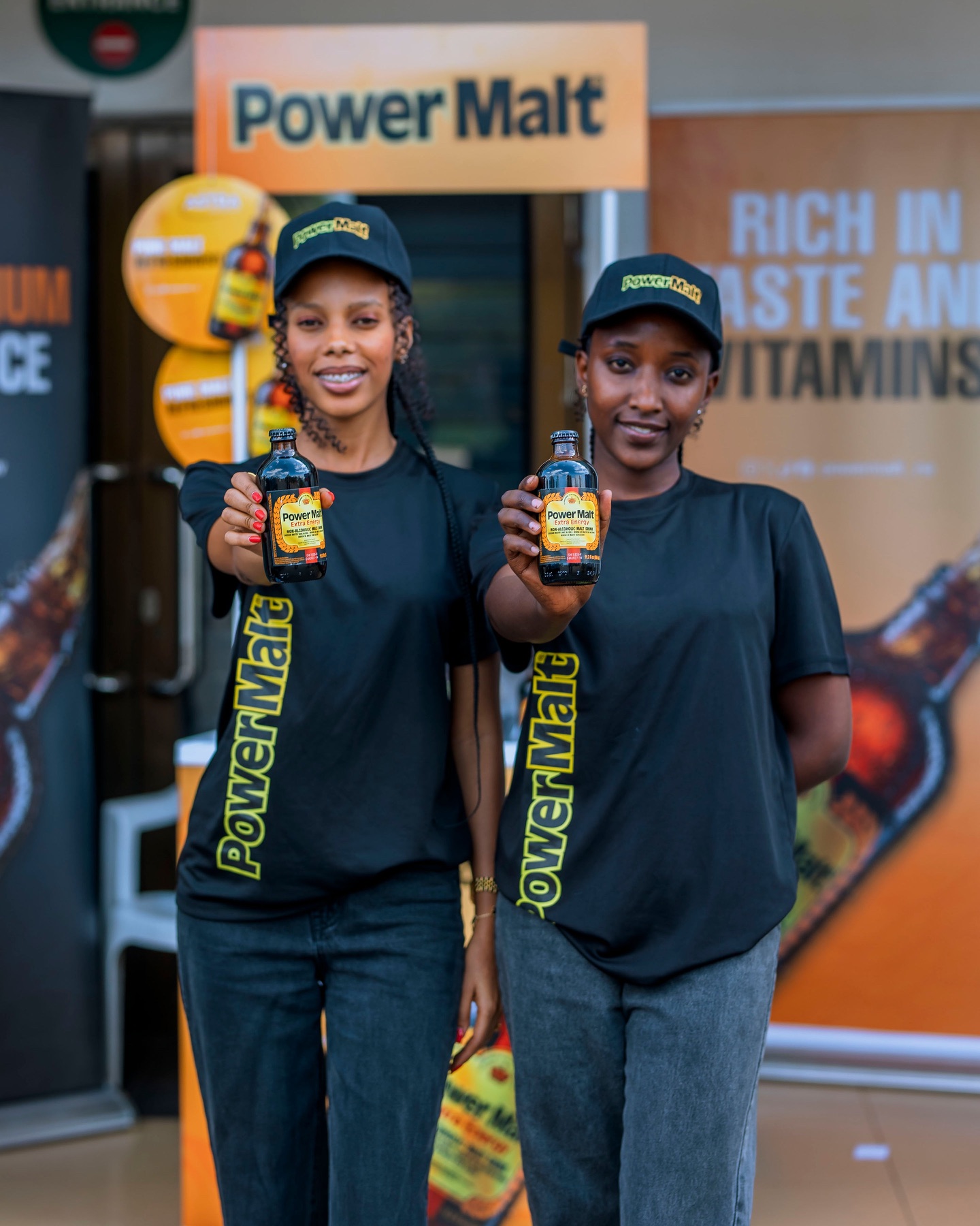 Power Malt ambassadors presenting bottles